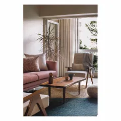 We believe in creating spaces that flow seamlessly. This living area uses a warm, earthy palette with a dusty rose sofa and natural wood furniture. The layout is thoughtfully planned to feel cozy and elegant, proving that even in a compact Mumbai apartment, you can create a soothing and comfortable home.