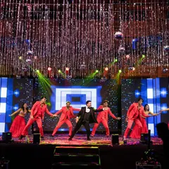 The groom takes center stage with his backup dancers for an electrifying performance. I coordinate with choreographers and artists to produce professional-level entertainment for your Sangeet.