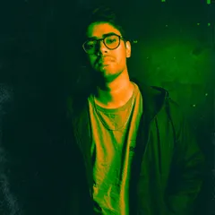 A press shot from a gig in Hyderabad. The green lighting captures the moody, bass-heavy atmosphere I often curate for my club nights.