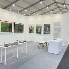 Our booth at Art Mumbai, ready for visitors. The curation balances large photographic prints, intricate sculptures, and delicate works on paper to create a dynamic presentation.