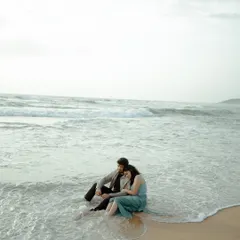 A quiet moment as the waves wash over their feet in Goa. This image captures the peaceful and romantic feeling of being by the sea together.