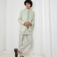This tonal kurta set by Darshika Menswear is a masterclass in minimal elegance. The clean lines, subtle texture, and perfect tailoring make it a versatile and sharp option for any festive occasion, from a puja to a sangeet.