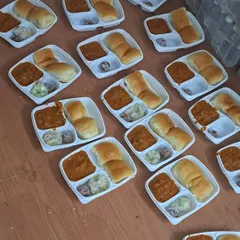 Pav Bhaji packed neatly in meal boxes for a school order. A convenient way to enjoy this classic dish.