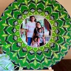 I love creating personalized mandala photo frames that tell your family's story. This custom piece was designed for a client, with a nature-inspired green palette to surround their treasured family portrait, turning a memory into a unique work of art.