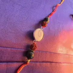 This Rakshabandhan, I have designed a Rakhi that is more than a thread; it's a shield of spiritual energy. This handcrafted Rakhi combines a Gomti Chakra for prosperity, Rudraksha for divine protection and confidence, and Pyrite for enhancing luck and clearing obstacles. It is a meaningful gift that continues to work long after the festival.