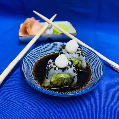 Our Truffle Edamame Sushi is a gourmet delight, combining earthy truffle with fresh edamame and perfectly seasoned rice, topped with a dollop of mayo.