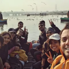 A happy selfie from a boat on the Yamuna, with seagulls flying overhead. This was a special part of one of our exploratory tours, discovering the river's ecosystem.
