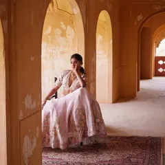 A beautifully composed shot within a heritage location. The architecture and the pastel lehenga come together to create a dreamy, romantic image.