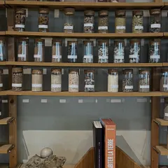 Our material library is a constant source of inspiration. These jars contain soil and aggregate samples from various locations, which we use to develop our custom, site-specific plaster and flooring finishes.