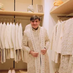 Trying on a beautifully crafted sherwani at the Tasva store. As a stylist, it's important for me to understand the fit, feel, and craftsmanship of the garments I recommend for my clients, ensuring they look and feel their best.
