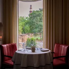 A table for two with a view that has witnessed centuries of history. This is one of my favorite spots, where you can enjoy our progressive Indian cuisine with the Qutub Minar framed perfectly in the window.