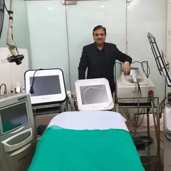 A photo of me in my clinic with some of our advanced laser systems. My mission is to provide the best skincare laser treatments at an affordable price, without compromising on quality or safety.