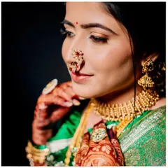 A close-up of Sanyukta's wedding look, featuring neutral tones and flawless skin. Can you guess how many hours apart this and the reception photo were taken?