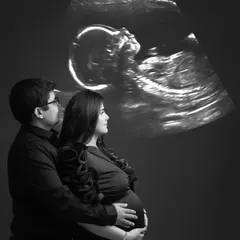 A truly unique and emotional portrait. Projecting the baby's sonogram onto the background creates a powerful image of the parents-to-be meeting their child for the first time.