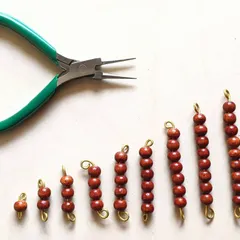 This image captures the story of how observation turns into creation. A young boy, after watching his mother make Montessori materials, decided to create his own set of bead bars late one night. It’s a powerful reminder that learning isn't scheduled; it's a spark that we must be ready to nurture whenever it appears.
