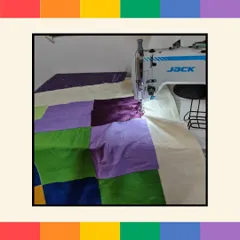A behind-the-scenes look at the Pride quilt being professionally stitched. We handle all the logistics, from providing the materials for the employee activity to ensuring the final product is beautifully finished.