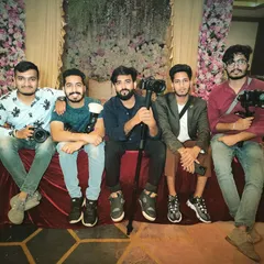 The photography and videography team taking a short break on stage. We bring a full crew equipped with cameras, gimbals, and monopods to every event.