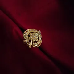 The 'Parn' gold-plated Jadau adjustable ring. Its unique, leaf-inspired design with pearl detailing makes it a beautiful statement piece for your hands.