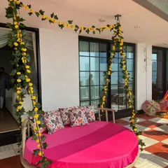 For this Mehendi, I installed a large circular swing decorated with yellow marigold garlands. It serves as a comfortable and stylish seating option for the bride.