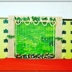 This image showcases the backdrop I designed for a traditional baby shower. The use of natural elements and sacred motifs like the lotus is central to my decoration style for these events.