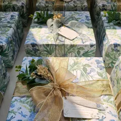 A look at the two different ribbon styles I used for these wedding favors. One is a sheer grey, and the other is a shimmering gold, offering two distinct but equally elegant finishes.