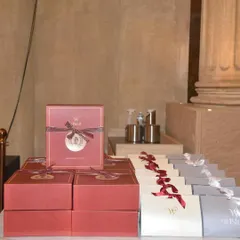 The gift station at the Gladia launch event. The red and grey boxes were designed to match the restaurant's sophisticated, Roman-inspired theme.