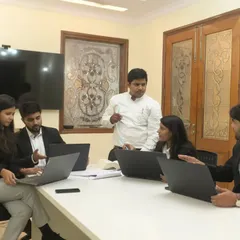 Leading a team discussion at our Defence Colony office. Collaboration and strategic brainstorming are central to how we approach every case.