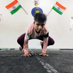 This student shows great strength and balance in a deep squat pose. Yoga is not just about flexibility; it builds a strong and stable foundation.