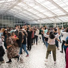 The party is in full swing inside our spacious glasshouse venue, perfect for large corporate gatherings and annual day celebrations.