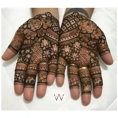 The front of the hands, featuring a mix of roses, lotuses, swans, and baby elephants.