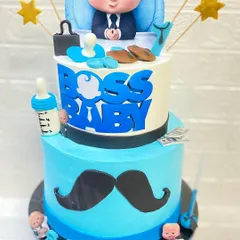 Who's the boss? This two-tier butterscotch Boss Baby cake is one of our most popular first birthday themes. We love creating detailed, fun-filled cakes for your little one's big milestones.