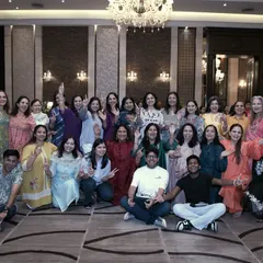 Our team posing with a group of enthusiastic family members during a rehearsal. We make sure our practice sessions are as fun as the final performance.