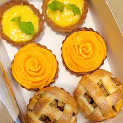 If you're bored with cake, try my assorted tarts. This box features a variety of fillings, including tangy Italian Lemon tarts, sweet Alphonso Mango tarts, and classic mini Apple Tarts with a lattice crust.