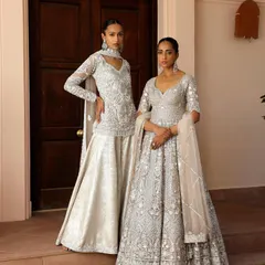 For this Saisha campaign, I focused on creating a look of timeless elegance. The styling highlights the intricate silver embroidery on the ivory lehenga and sharara set, presented in a clean, grand setting to emphasize the luxury and craftsmanship of the collection.