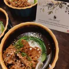 Our Massaman Raan with Sticky Rice, a luxurious small plate served at the celebration for "Made in Heaven". It's a rich, flavorful dish perfect for a flying buffet at a high-end party.