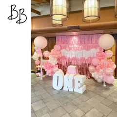 Another perspective of the 'ONE' birthday setup, showing how the balloon columns and fringe wall create a complete and immersive photo zone for the celebration.