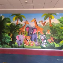 A similar jungle animal mural, featuring a slightly different cast of characters. These custom murals can be adapted to fit any wall size.
