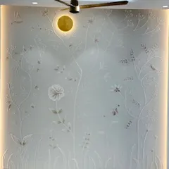 Texture adds a layer of depth and elegance that invites you to look closer. This 3D floral mural, created with plaster for a living room, plays with light and shadow to create a subtle yet stunning focal point.