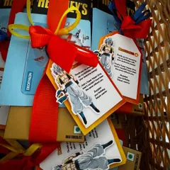 A basket of party favors, each with a custom-designed thank you tag to match the birthday theme.