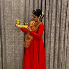 Posing with the Rashtriya Achiever Award. This award is not just a personal achievement but a responsibility to continue my 'sadhana' and guide the next generation of dancers with devotion.