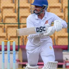 A batsman in perfect position, ready to execute a shot during a match. This image captures the focus and technical stability we strive to instill in every player, preparing them for real game pressure.