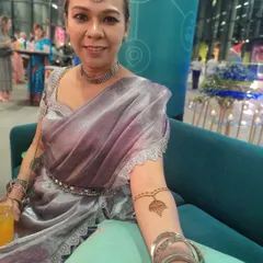 This lovely lady is all dressed up for a party, and her simple arm mehendi adds the perfect festive touch. This shows how a small design can complete a look.