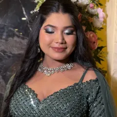 This is a perfect example of a full glam look with dramatic, smokey silver and black eyeshadow. To balance the intensity of the eyes, I kept the skin dewy and the lips a soft, glossy nude, creating a sophisticated look for a reception or sangeet.