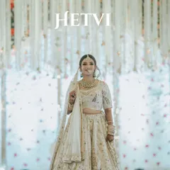 Our elegant bride stands before a backdrop of cascading white floral strings. This type of detailed decor adds texture and a dreamy quality to the wedding photos.