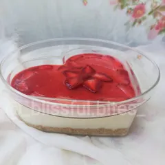 My no-bake fresh strawberry cheesecake, presented in a lovely heart-shaped dish. This dessert is a seasonal favorite, featuring a creamy cheesecake filling and a vibrant topping made with fresh strawberries.
