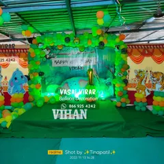 We brought the jungle to life for Vihan's first birthday. This jungle safari theme uses a lush green backdrop, animal cutouts, and a full balloon arch to create a wild and fun adventure for all the guests.