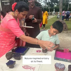 (Image) There's something special about seeing families create together. At this nature-inspired event, a mother helps her son make his first print, creating a memory that will last long after the ink dries.