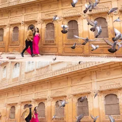 A spontaneous and magical moment as pigeons take flight around the couple in Jaisalmer. These are the unscripted shots that often become the most cherished, adding life and movement to the pre-wedding album.
