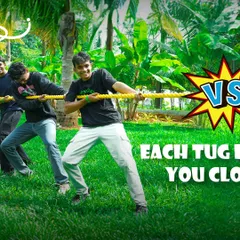 Each tug brings you closer to victory. A team gives it their all in a game of Tug of War on our lush green lawns, a classic team-building activity.