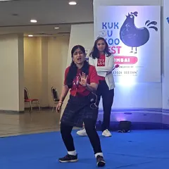 Two of our teachers performing a scene on stage. Their expressive faces and gestures tell a story all on their own, capturing the attention of the children sitting in the audience. This is storytelling in its most active form.